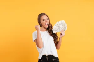 woman holding money and exclaiming
