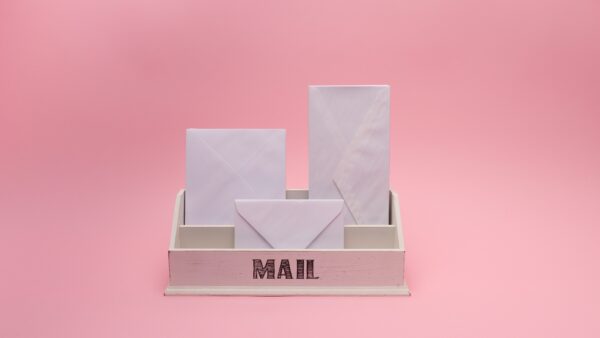 mail arriving on a pink background